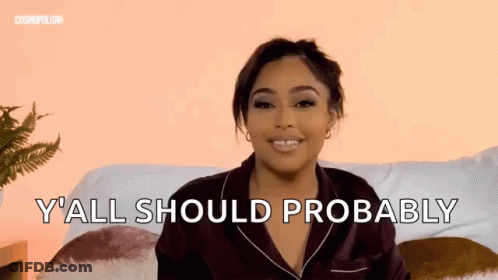 Woman Sitting On Couch With Y All Should Probably Behind Her GIF