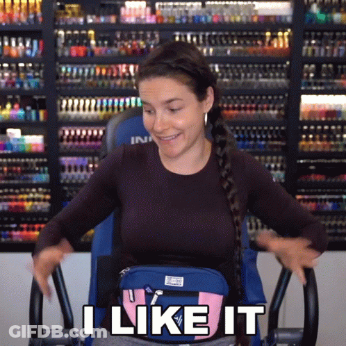Woman Sitting On Exercise Bike With Bag Saying I Like It GIF