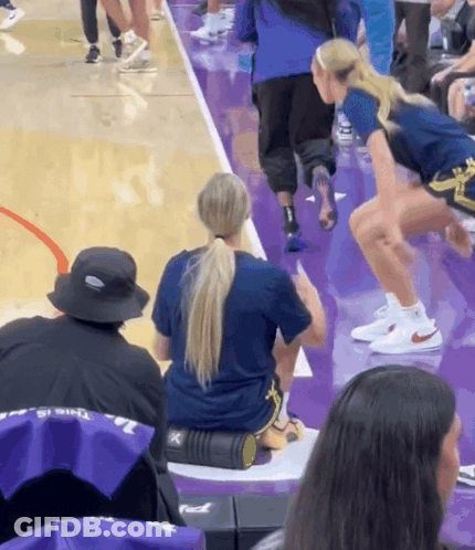 Woman Sitting On Foam Roller Purple Court GIF