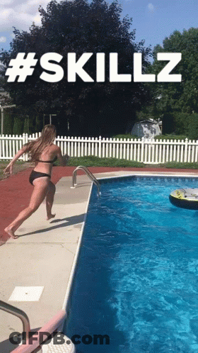Woman Sitting On Inflatable Hippo In Pool GIF