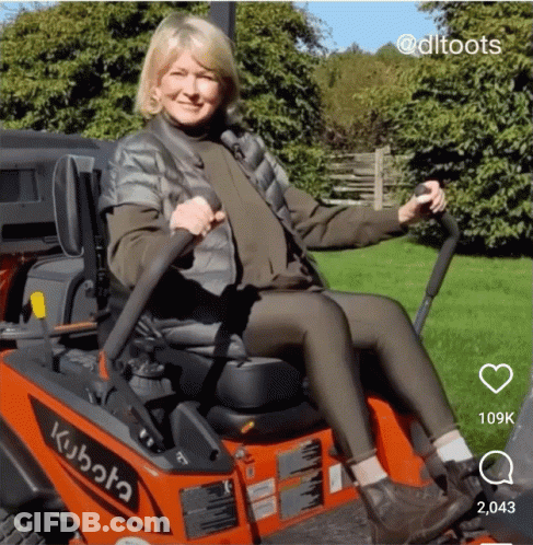 Woman Sitting On Kubota Lawn Mower GIF