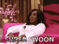 Woman Sitting On Pink Couch Saying Super Swoon GIF