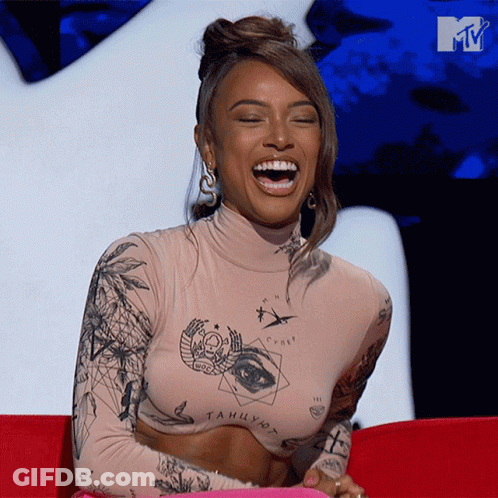 Woman Sitting On Red Couch GIF
