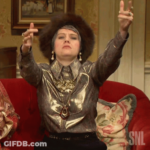 Woman Sitting On Red Couch With SNL GIF