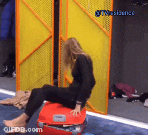 Woman Sitting On Red Suitcase By Yellow Door @Tvresidence GIF