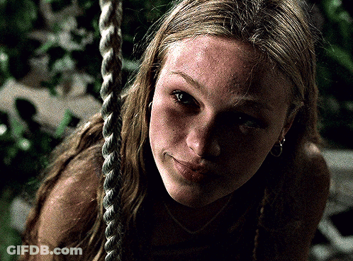 Woman Sitting On Rope Swing Close Up GIF