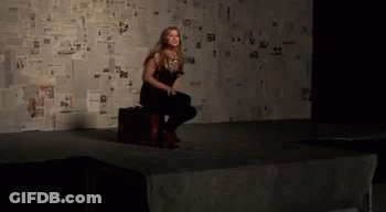 Woman Sitting On Suitcase Screaming GIF