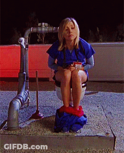 Woman Sitting On Toilet With Cup GIF