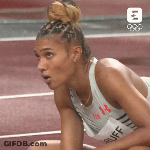 Woman Sitting On Track Looking At Something GIF
