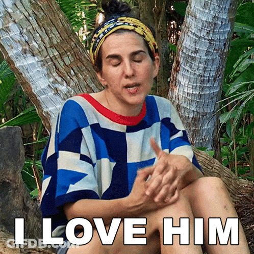 Woman Sitting On Tree Trunk Saying I Love Him GIF