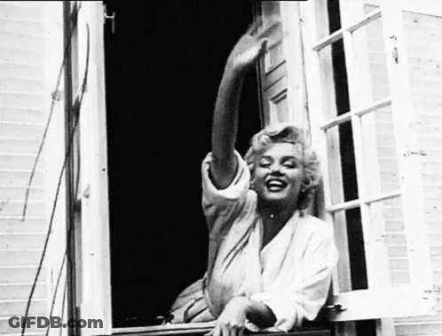 Woman Sitting On Window Sill With Outstretched Arms GIF