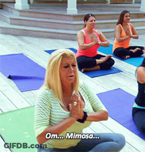 Woman Sitting On Yoga Mat With Om Mimosa GIF