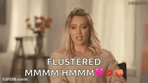 Woman Sitting Saying Flustered Mmmm Hmmm GIF