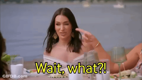 Woman Sitting Says Wait What GIF