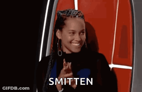 Woman Sitting Smitten GIF