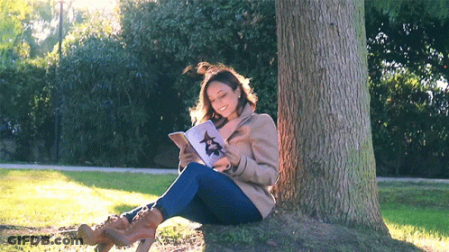 Woman Sitting Under Tree Reading Book With Star GIF