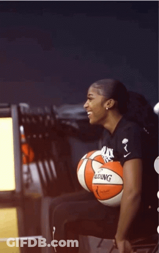 Woman Sitting With Basketball GIF
