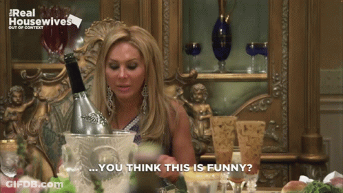 Woman Sitting With Champagne Bucket And Saying You Think This Is Funny GIF