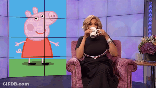 Woman Sitting With Coffee In Front Of Peppa Pig Screen GIF