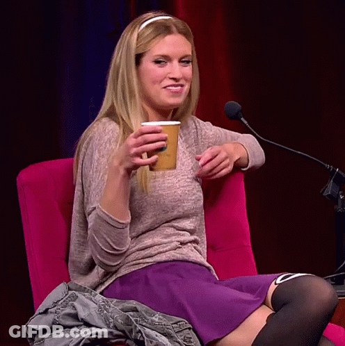 Woman Sitting With Cup Saying A GIF