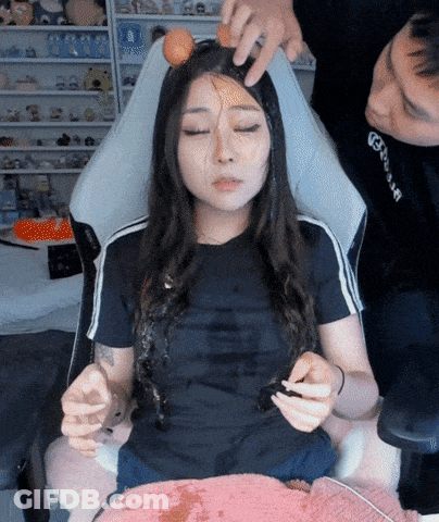 Woman Sitting With Egg On Forehead GIF