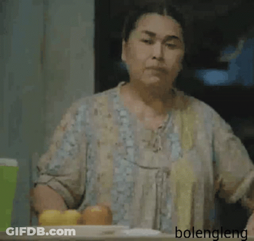 Woman Sitting With Hand On Forehead GIF