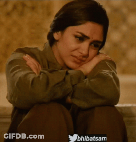 Woman Sitting With Head On Hands And Twitter Icon GIF