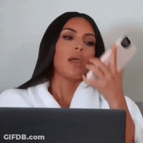 Woman Sitting With Laptop And Cell Phone GIF