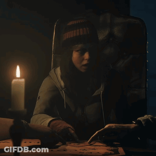 Woman Sitting With Lit Candle Cross Jacket GIF