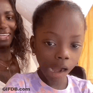 Woman Sitting With Little Girl In Purple Shirt GIF