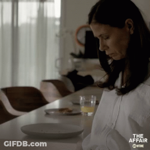 Woman Sitting With Orange Juice And Food GIF