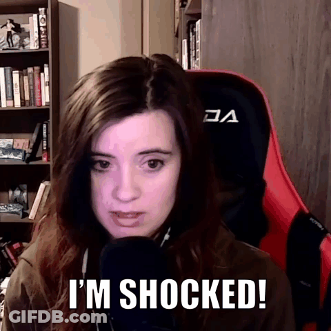 Woman Sitting With Shocked Expression GIF