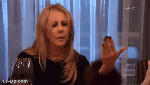 Woman Sitting With Wine And Bravo Sign GIF