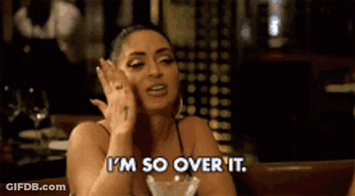 Woman Sitting With Wine Saying I'm Over It GIF