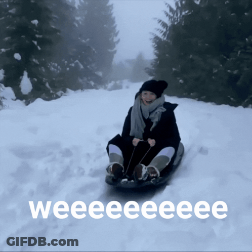 Woman Sledding Down Snowy Hill Weee GIF