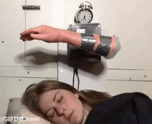 Woman Sleeping Near Alarm Clock GIF