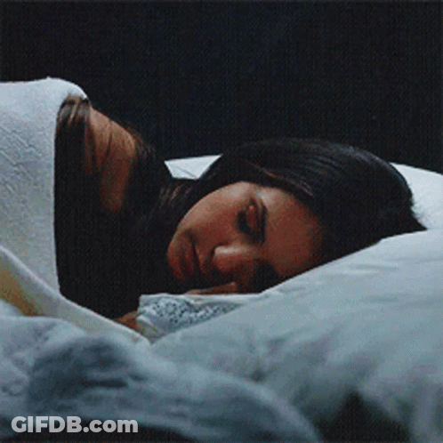 Woman Sleeping On Bed With Head On Pillow GIF
