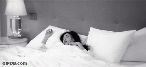 Woman Sleeping On Bed With White Sheets GIF