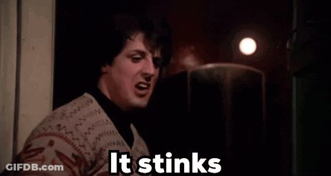 Woman Smelling In Dark Room Saying It Stinks GIF