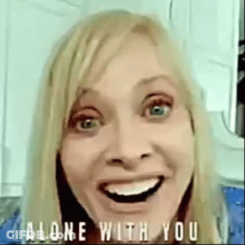 Woman Smiling And Making Funny Face Saying Alone With You GIF