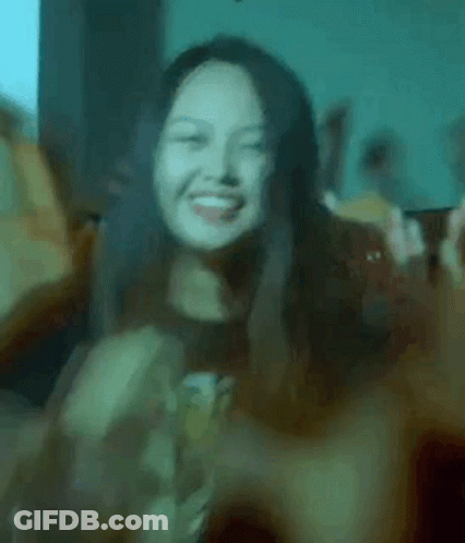 Woman Smiling And Making Peace Sign GIF