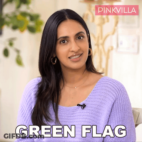 Woman Smiling And Saying Green Flag GIF