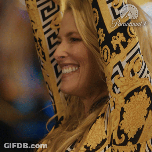 Woman Smiling Arms In Air With Paramount Logo GIF