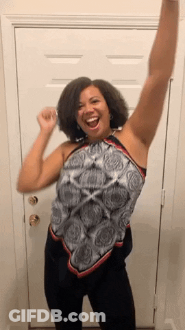 Woman Smiling Arms Up Near Door GIF