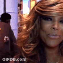 Woman Smiling At Camera Man Behind GIF