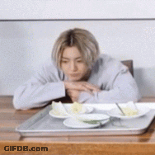 Woman Smiling At Camera Man In Kitchen GIF