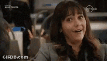 Woman Smiling At Desk GIF