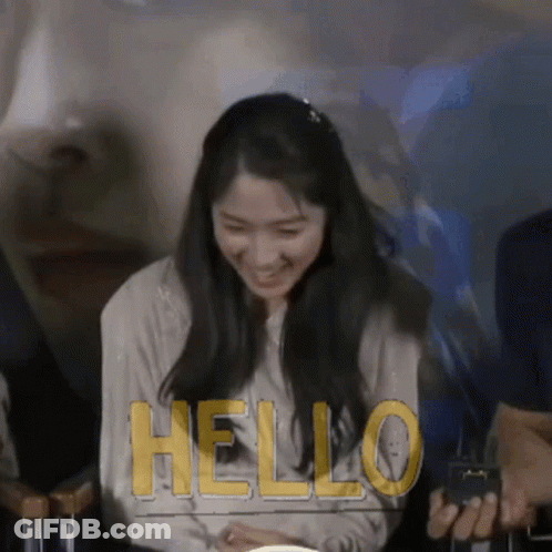 Woman Smiling At Hello Sign GIF