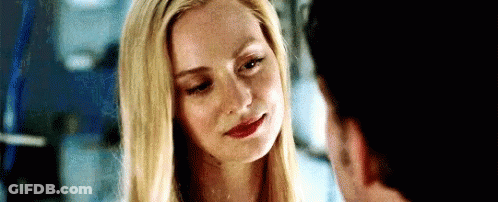 Woman Smiling At Man With Eyes Closed GIF