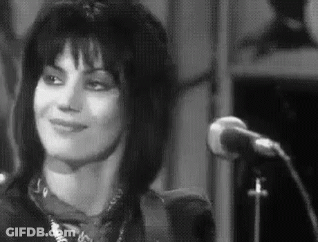 Woman Smiling At Microphone GIF